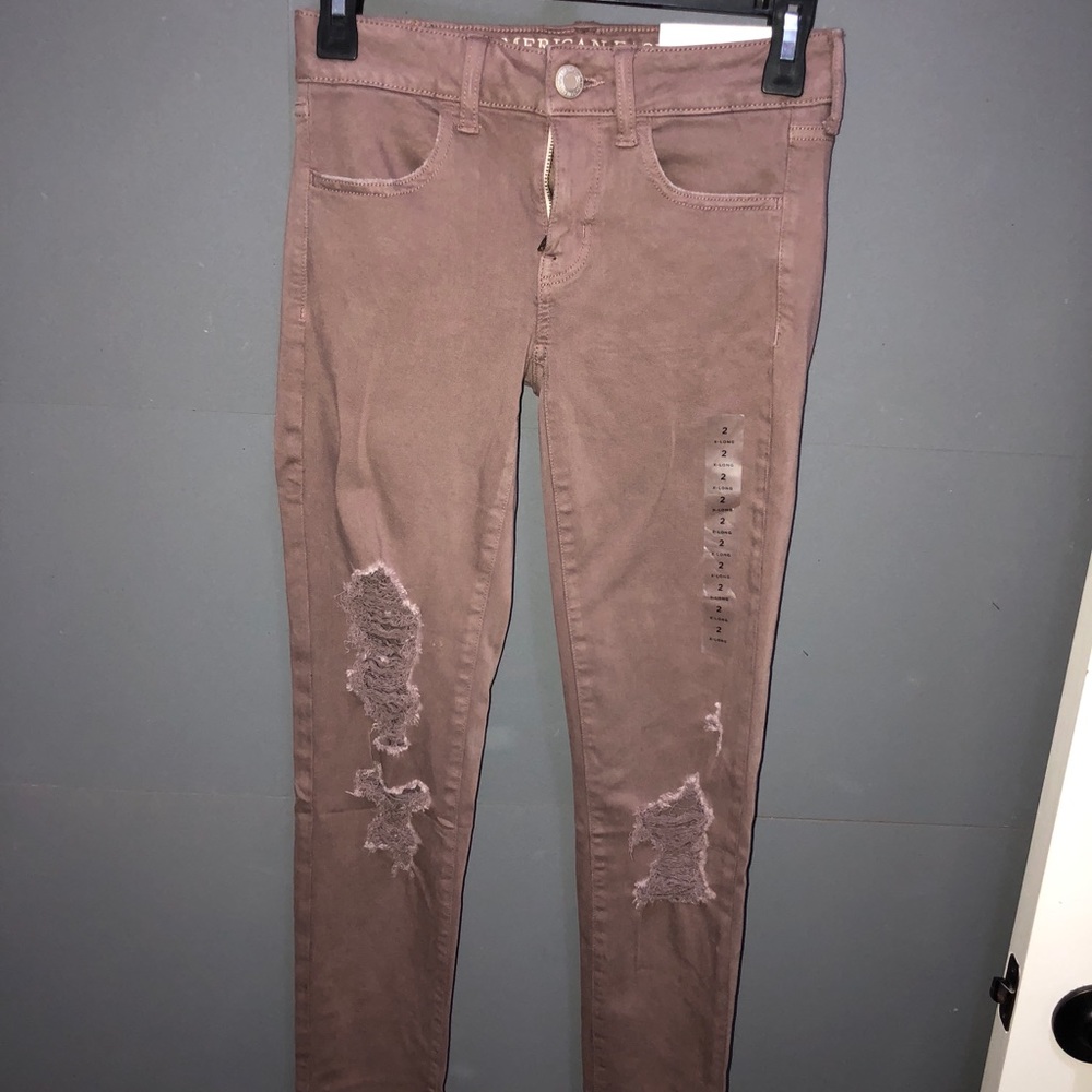 rose/pink ripped jeans, too small